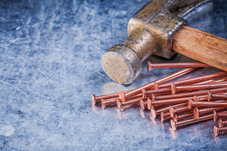 Copper nails with hammer