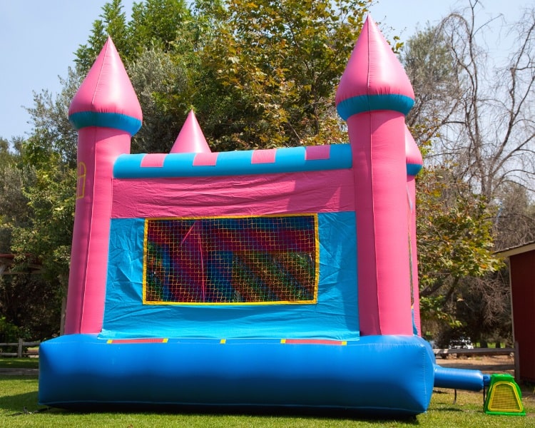 Inflatable bounce house in backyard