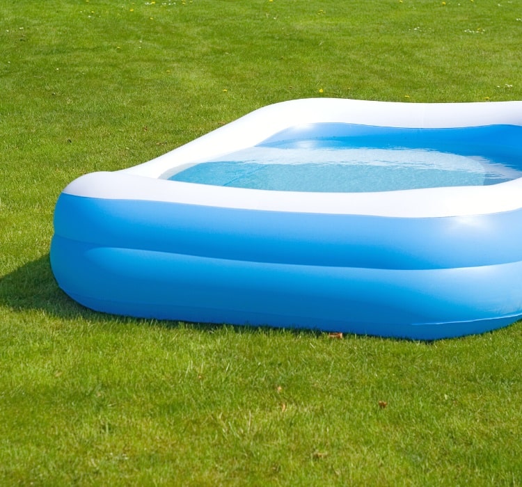 Inflatable kiddie pool in backyard