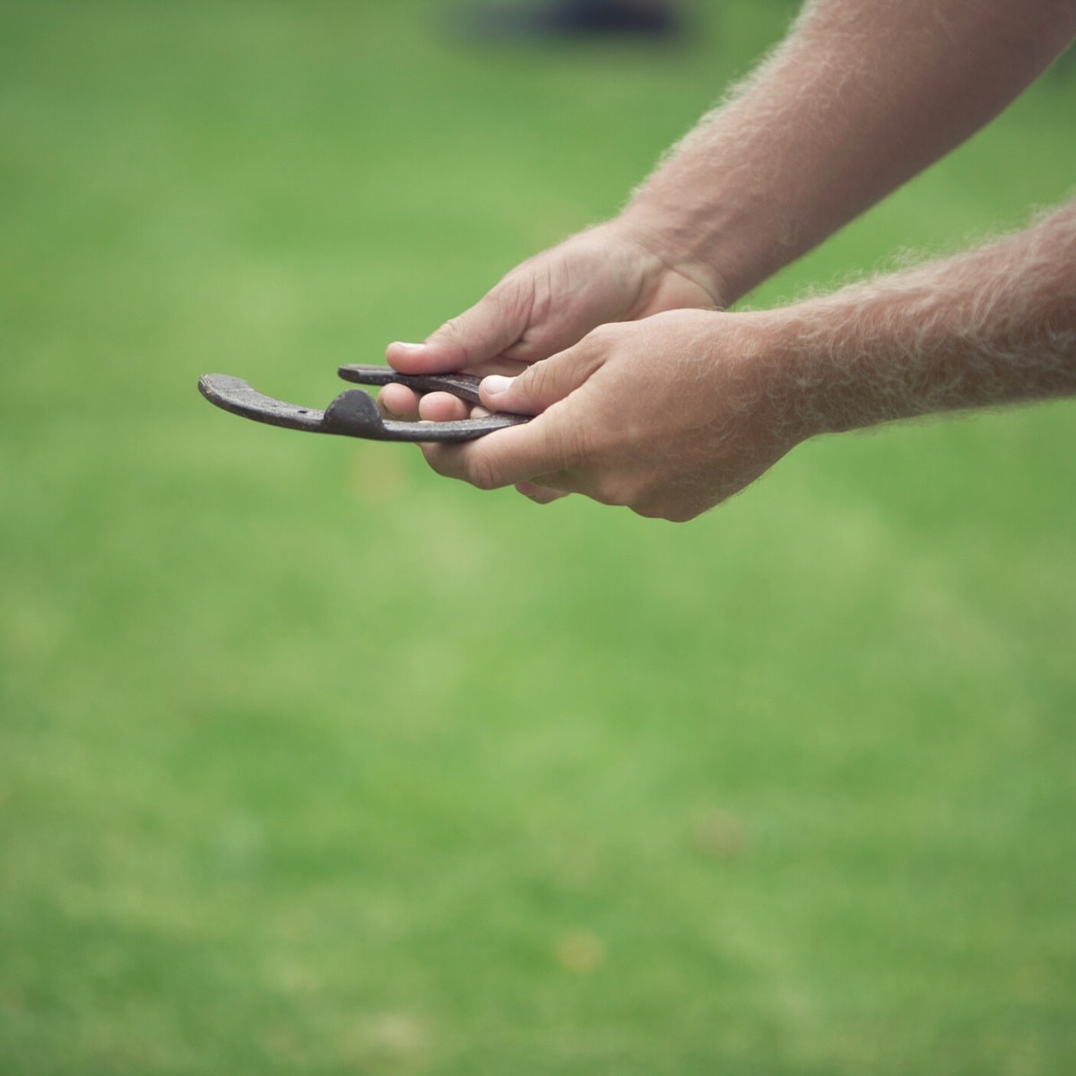 Man preparing to throw a horseshoe